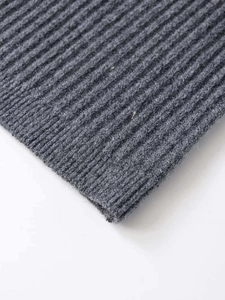 Close-up of grey ribbed knit fabric showing detailed texture and high elasticity
