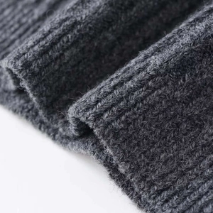 Close-up of charcoal gray ribbed knit fabric texture on a slim-fit summer short sleeve top