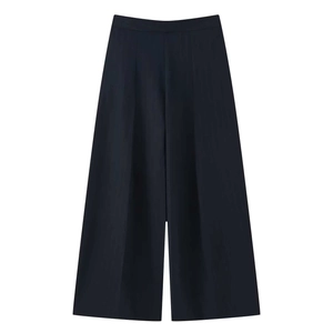 Detail of high-waisted wide leg trousers in navy with sharp front pleats and tailored finish