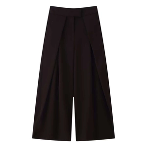 Detailed view of high-waist wide-leg culottes with deep front pleats in dark coffee brown
