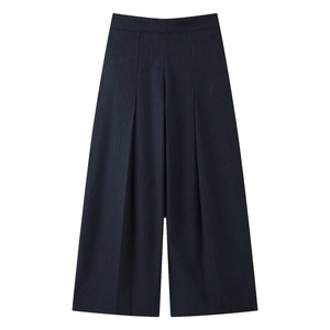Detail of navy blue wide-leg trousers with white pinstripes and knit texture fabric