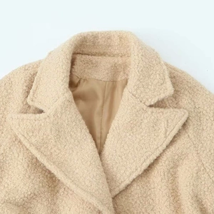 Beige faux shearling long coat for women with a warm lapel collar and soft inner lining