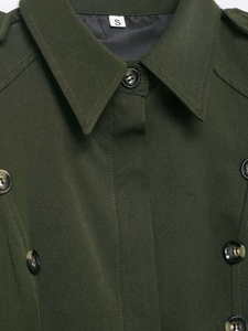 Detail of army green double-breasted dress showing tortoiseshell buttons and shoulder epaulets