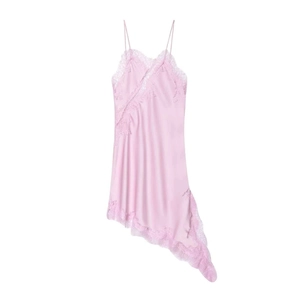 Pink silk slip dress with eyelash lace trim and asymmetric hem on white background