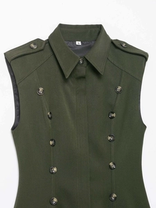 Detail of dark green sleeveless military dress with double-breasted buttons and shoulder straps