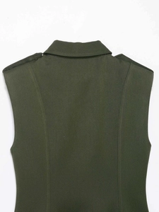 Close-up of olive green sleeveless dress back featuring military-style epaulettes and collar