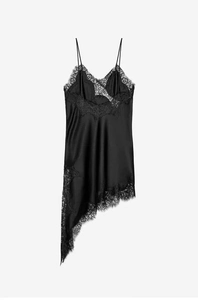 Detail of black satin slip dress showing delicate eyelash lace neckline and silk-like texture