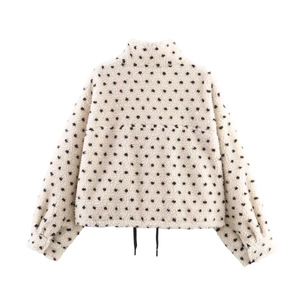 Fashionable beige fleece jacket with black polka dots, zip-up stand collar and drawstring hem
