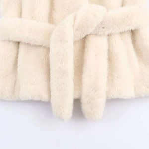 Chic cream faux fur coat for women featuring a stylish waist belt and soft fluffy texture