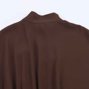 Detail of coffee brown stand collar top showing fine stitching and jersey fabric texture