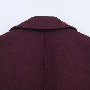 Close-up of a long dark burgundy wool blend coat showing the collar and back seam detail