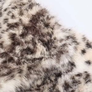 Macro shot of high-quality faux leopard fur texture with soft fluffy animal print fibers