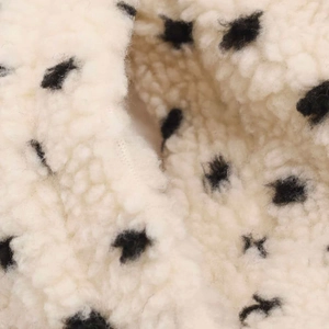Chic cream fleece jacket with black polka dots, soft plush faux shearling texture detail