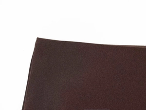 Detailed close-up of dark brown fabric texture and fine stitching on the skirt hemline