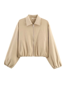 Detailed view of beige cropped casual jacket with silver zipper and elastic cuffs