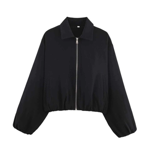 Detail view of black cropped jacket with zip-up front and elasticized hem and cuffs