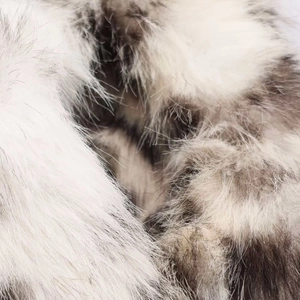 Close-up of soft faux fur texture with animal leopard print for winter coats