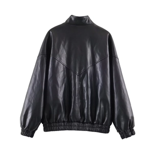 Detail view of the elasticated hem and back silhouette of a black faux leather jacket