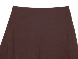 Detailed view of the dark brown skirt showing the waistline and invisible side zipper