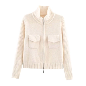 Detail of the high collar and metal zipper on the cream white knit cardigan sweater