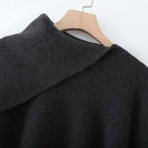 Deep charcoal gray ribbed knit sweater with a unique asymmetrical turtleneck design