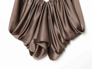 Detail of coffee satin camisole showing luxurious silk texture and draped pleat design