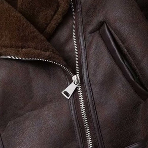 Brown faux shearling aviator jacket with metallic zipper and warm plush lining detail