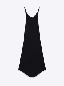 Detail of elegant black spaghetti strap dress featuring asymmetrical hem and V-neckline