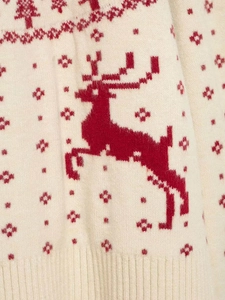 Detailed close-up of red elk and snowflake jacquard patterns on white knit sweater