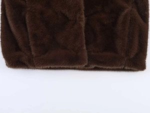 Detailed close-up showing texture of premium dark brown faux fur fabric and stitching