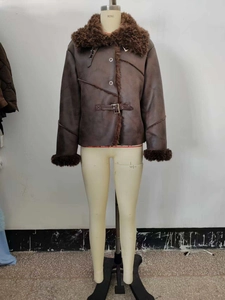Detailed view of women winter jacket with plush faux fur trim and moto buckle details