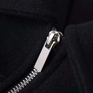 Women's black wool cropped jacket featuring a polished silver metal zipper detail