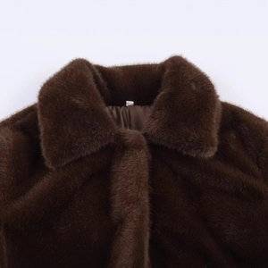 Deep brown faux fur coat with large lapel and smooth satin lining in a flat-lay view