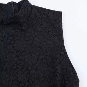Close-up of black floral lace mock neck dress with a concealed back zipper closure