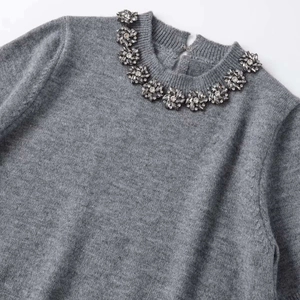 Grey round neck short sleeve knit sweater with crystal flower bead details on the collar
