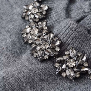 Gray short sleeve knit top featuring intricate 3D crystal floral beadwork detail