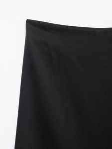 Close-up of the high-waist lace stitching on a slim-fit black fashion skirt