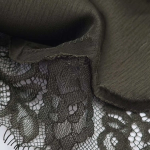 Elegant olive green satin dress featuring delicate lace trim and fine stitching detail