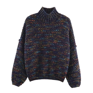 Loose knit sweater for women with colorful speckled yarn and ribbed turtleneck design