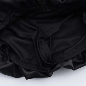 Detailed close-up showing precision stitching and fabric texture of the black satin dress lining