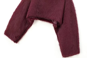 Detailed close-up of high-quality wine red faux fur texture and inner silk lining
