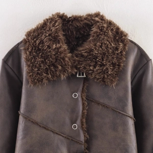 Women's dark brown faux shearling jacket with a fluffy collar and silver metal buckles