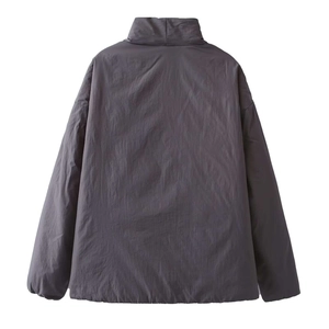 Back view of a dark grey minimalist windproof jacket with drop shoulders and elastic cuffs