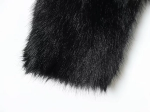 Detailed close-up of high-density black faux fur texture with elegant fluffy fibers