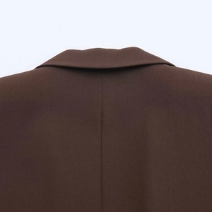 Detailed view of the back collar and stitching on a dark brown blazer for women