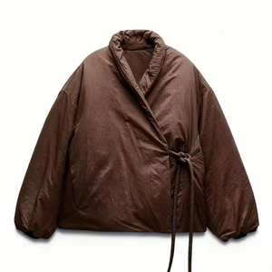 Women's minimalist brown quilted wrap jacket with side-tie closure and stand collar