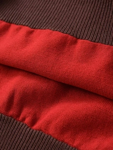 Macro shot of bicolor red and dark burgundy ribbed knit fabric texture and detail