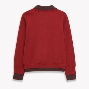 Classic red knit polo sweater with contrasting dark brown collar and sleeve cuffs