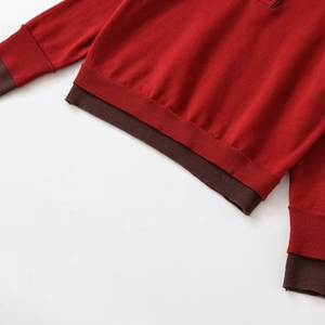 Classic red knit sweater with contrasting dark brown ribbed cuffs and POLO collar detail