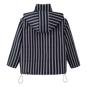 Detail of black and white striped hooded puffer jacket featuring adjustable hem drawstring